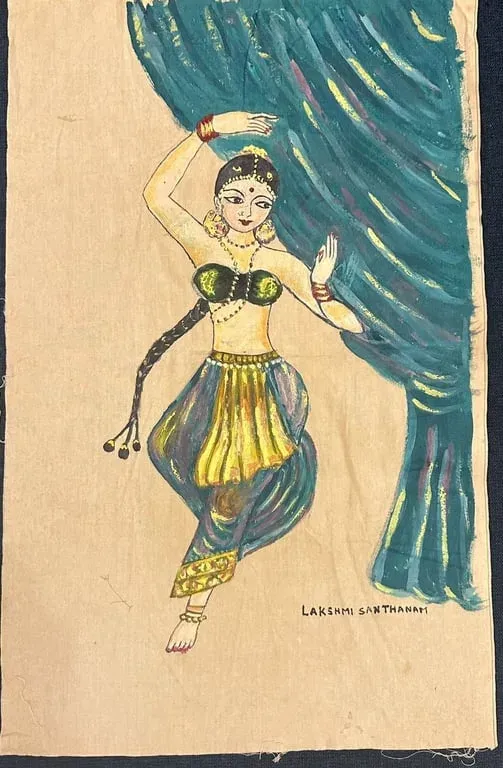 Fabric painting of a Bharatanatyam dancer mid-pose beside a blue curtain, signed Lakshmi Santhanam