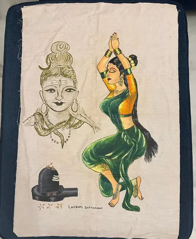 Fabric painting of a dancer in green beside a Shiva lingam, with a sketched face of Shiva above