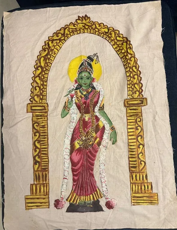 Fabric painting of a green-skinned goddess in red silk standing beneath a golden arch