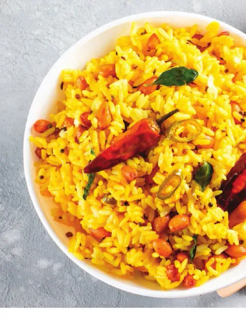 Lemon rice with peanuts, curry leaves and dried red chillies